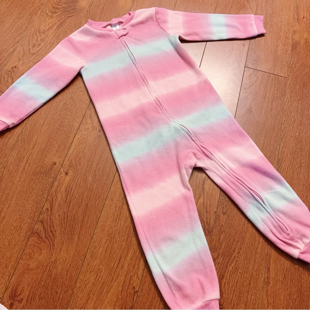 Adorable pastel fleece one-piece pajama featuring soft dreamy stripes